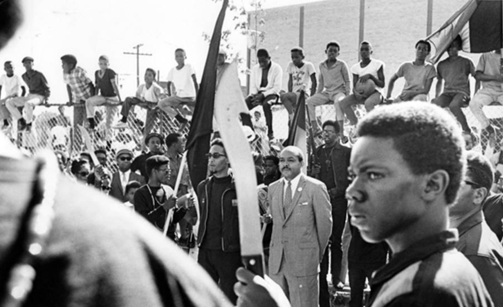 Mayor Carl Stokes and Harllel Jones Watch a Drill Team